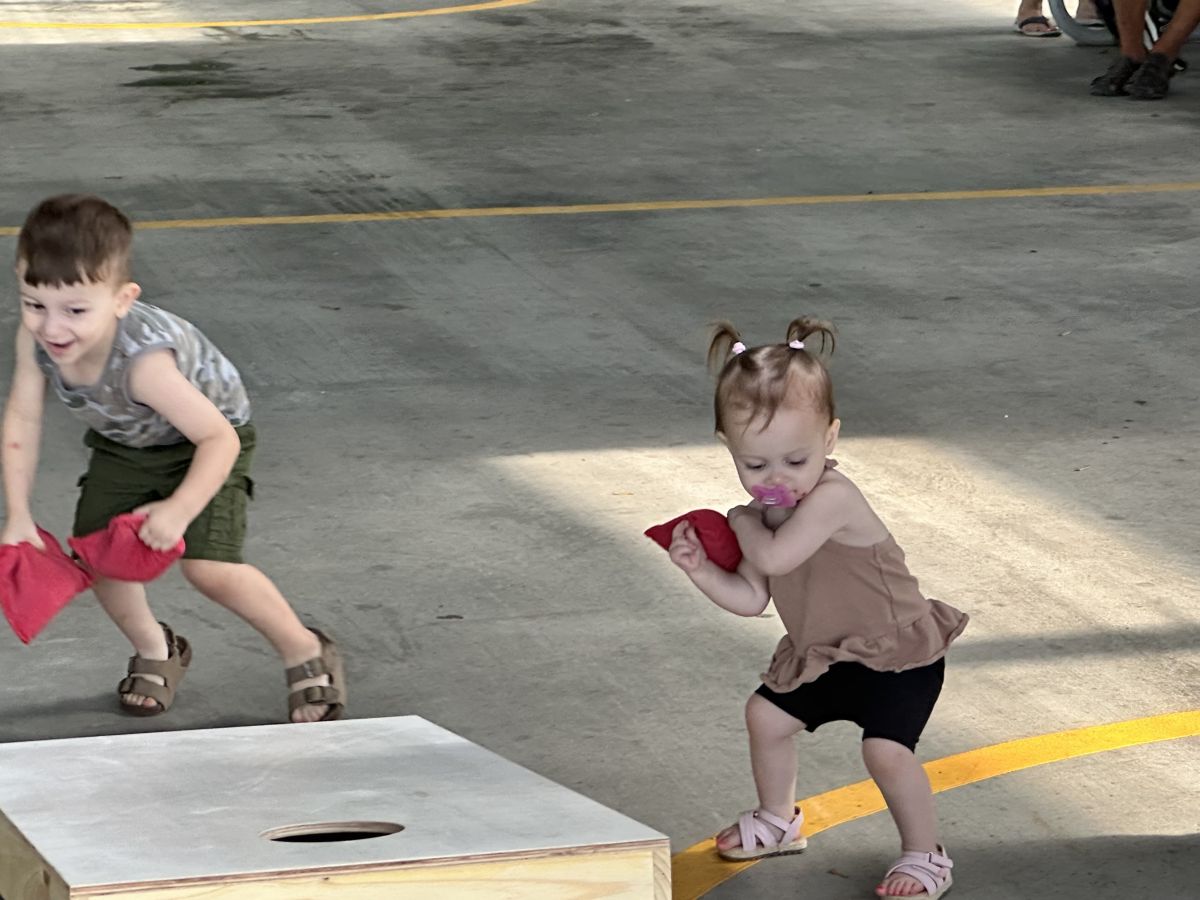 KIDS PLAYING AT MARKET