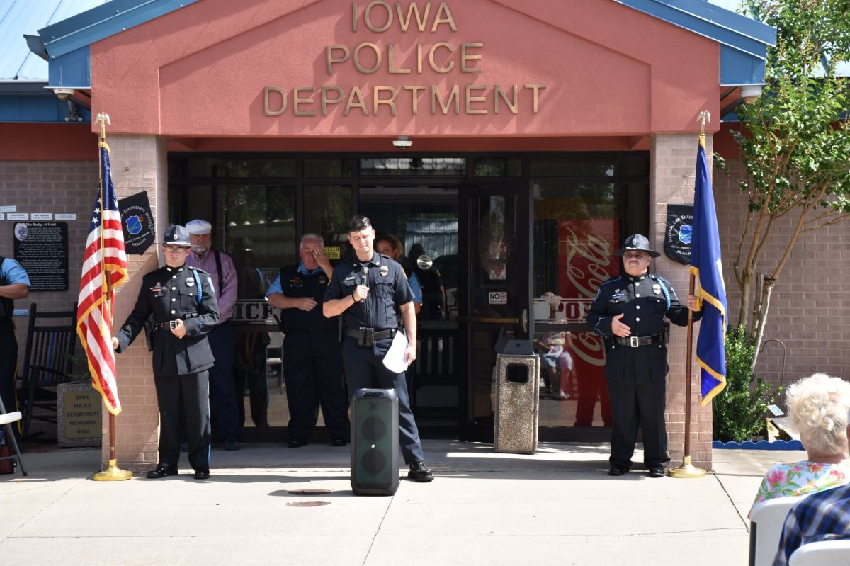 Policemen in front of police station giving a speech