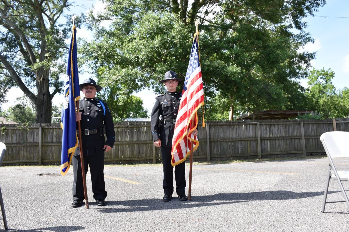Policeman holding American Flag