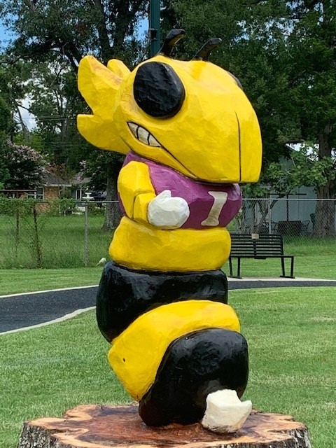 Yellow Jacket carved out of a tree